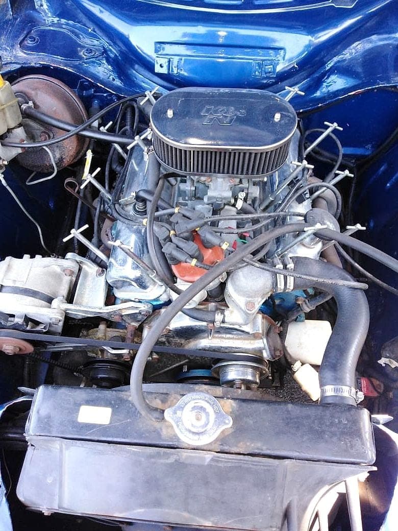 Classic car engine bay with performance air filter